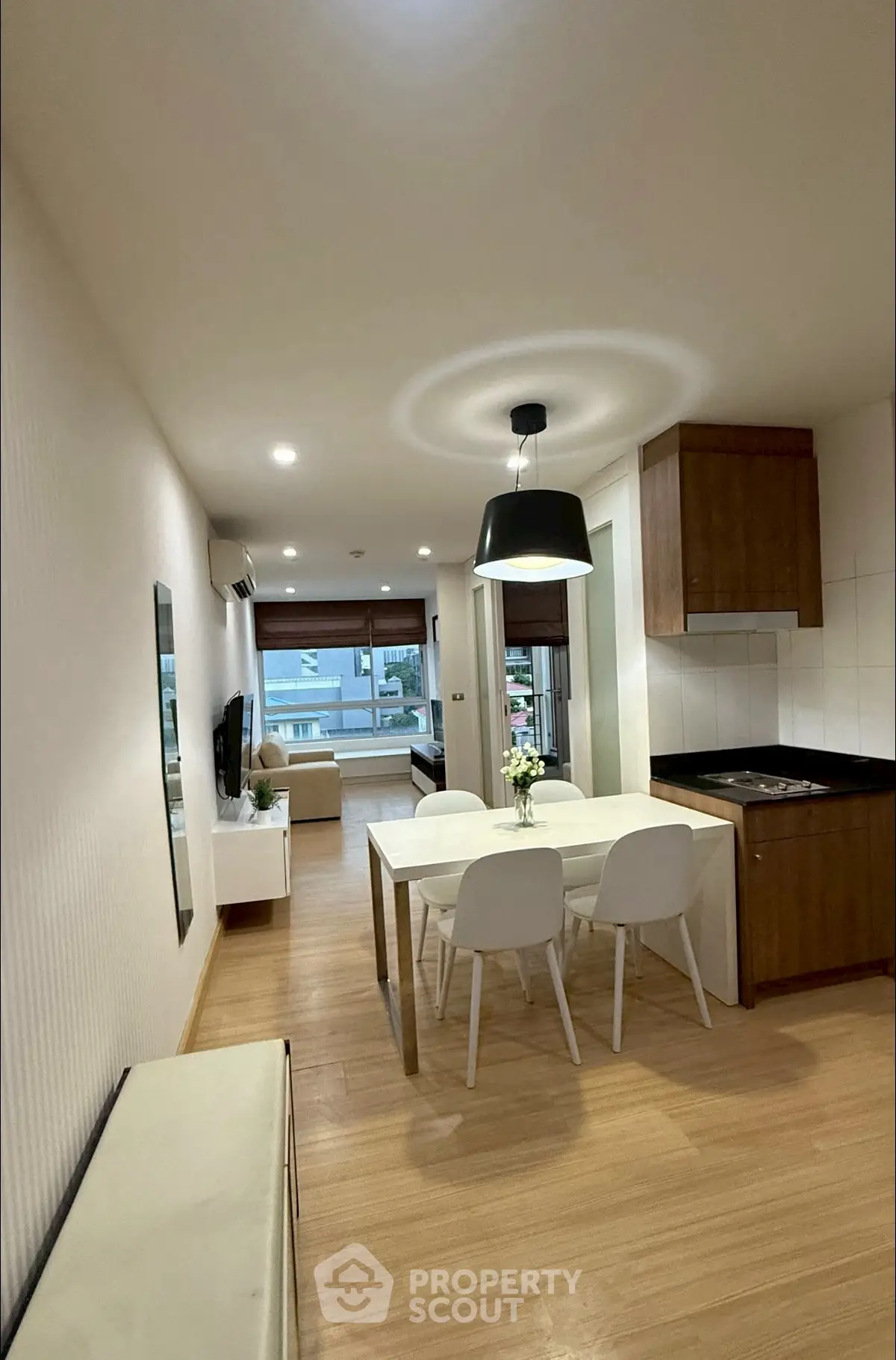 Modern open-plan living and dining area with stylish decor and natural light.