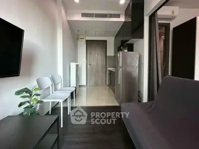 Modern apartment living room with sleek kitchen and stylish decor