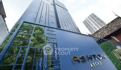 Modern high-rise building with sleek design and lush greenery at Ashton Asoke.