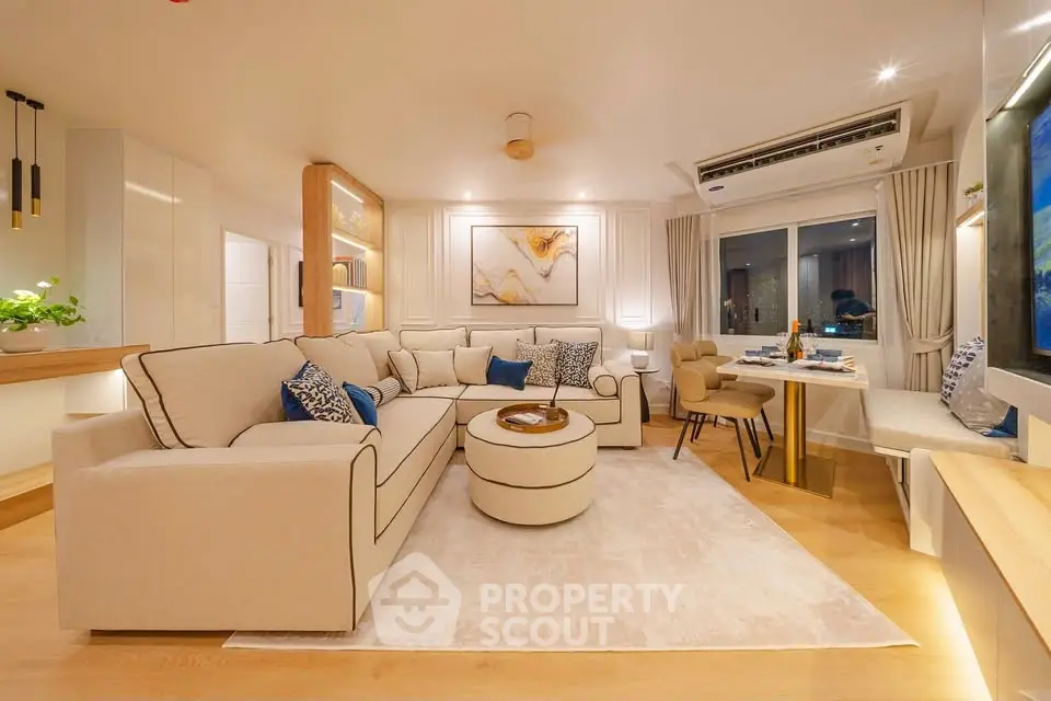 Luxurious modern living room with elegant decor and spacious seating area.