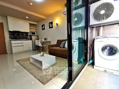 Modern apartment with cozy living room and laundry area