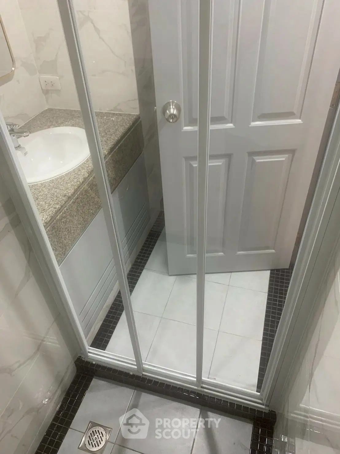 Compact bathroom with shower and modern fixtures