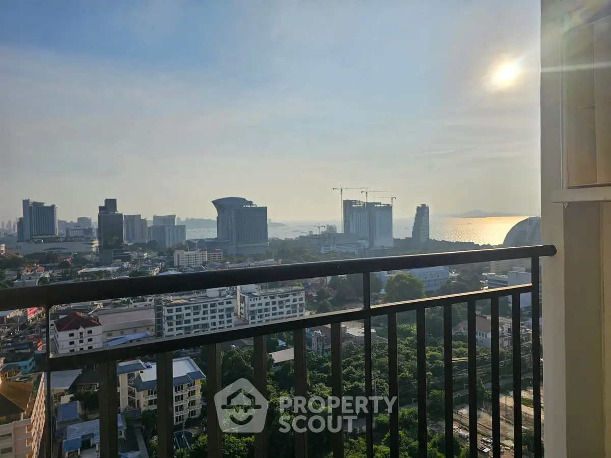 Stunning cityscape view from a high-rise balcony at sunset, perfect for urban living enthusiasts.