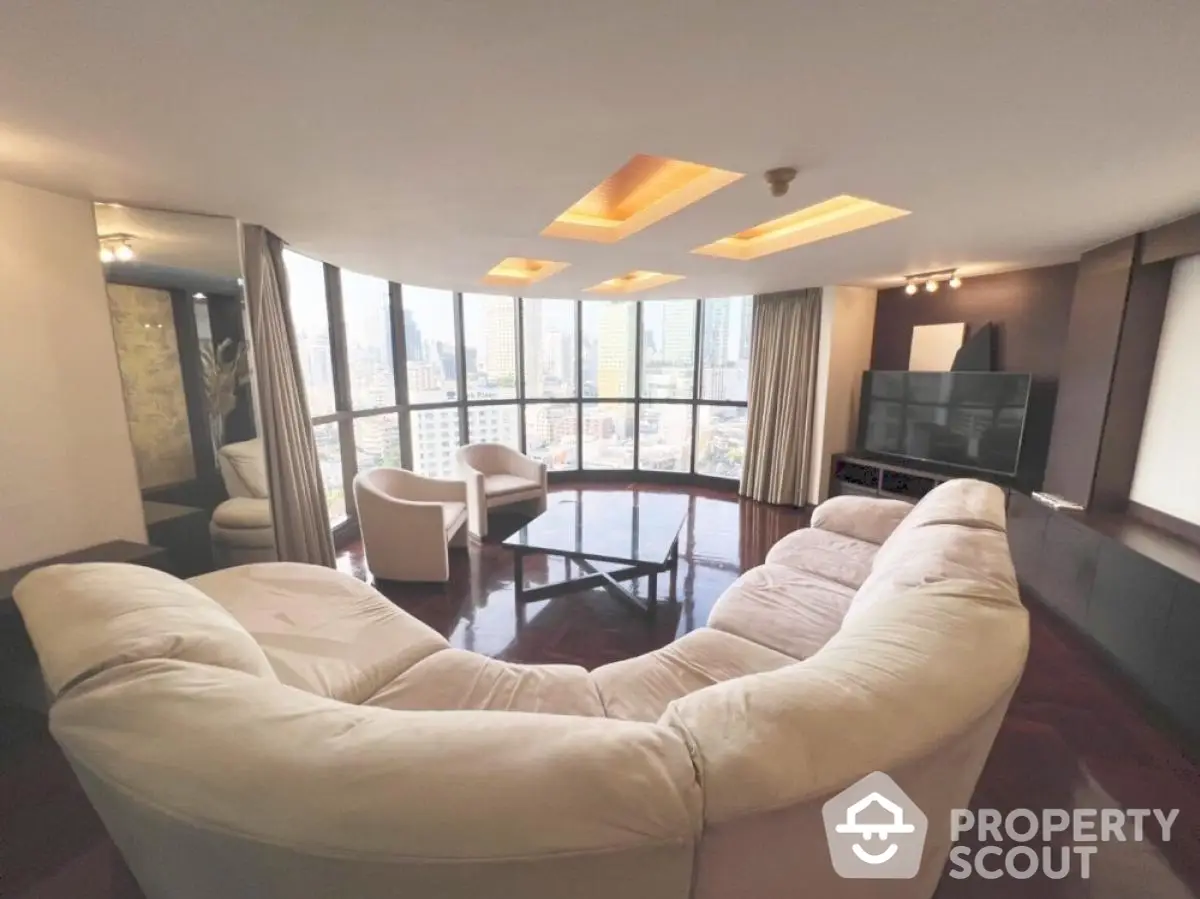 Luxurious living room with panoramic city views and plush seating