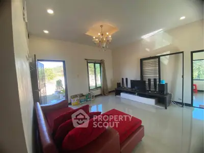 Spacious living room with modern decor and natural light