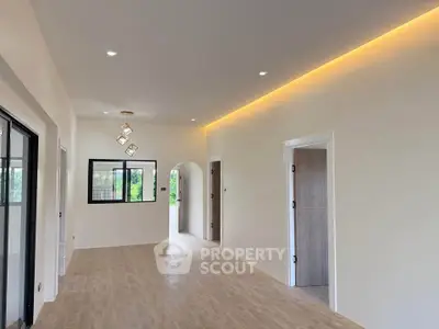 Spacious modern interior with elegant lighting and open layout