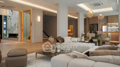 Luxurious open-plan living room with modern decor and elegant lighting in a high-end apartment.