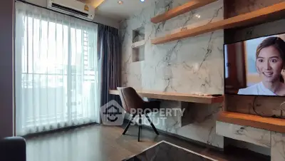 Modern living room with marble wall, TV, and balcony view
