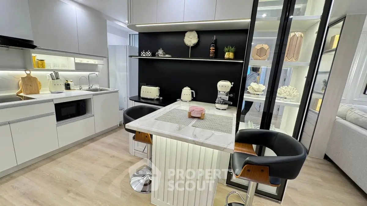 Modern kitchen with sleek design and breakfast bar seating