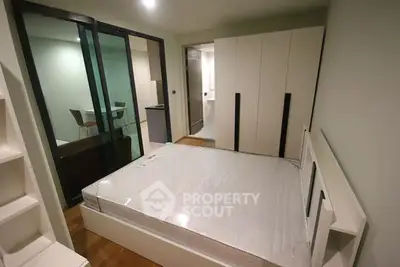 Modern bedroom with sleek design and built-in wardrobe, perfect for urban living.