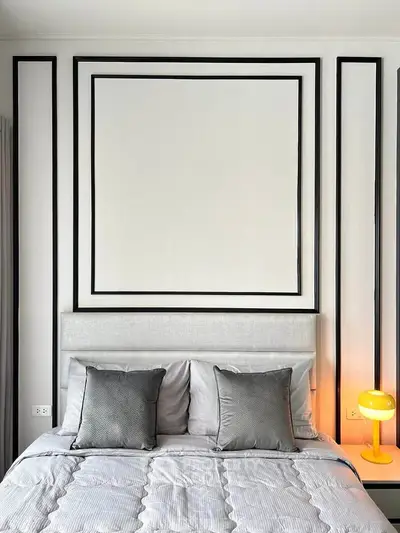 Modern bedroom with stylish decor and cozy lighting