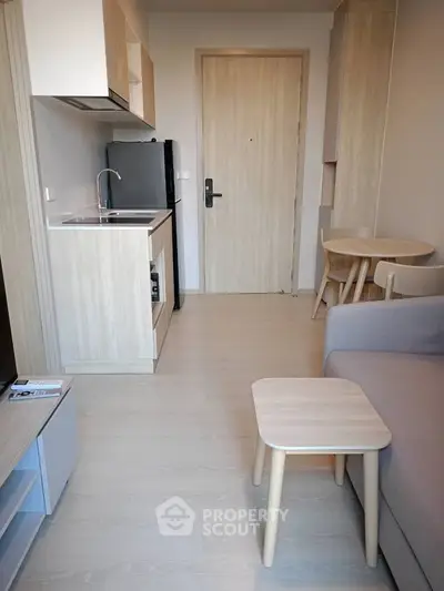 Modern compact apartment with open kitchen and cozy living area