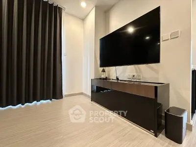 Modern living room with sleek TV setup and elegant flooring