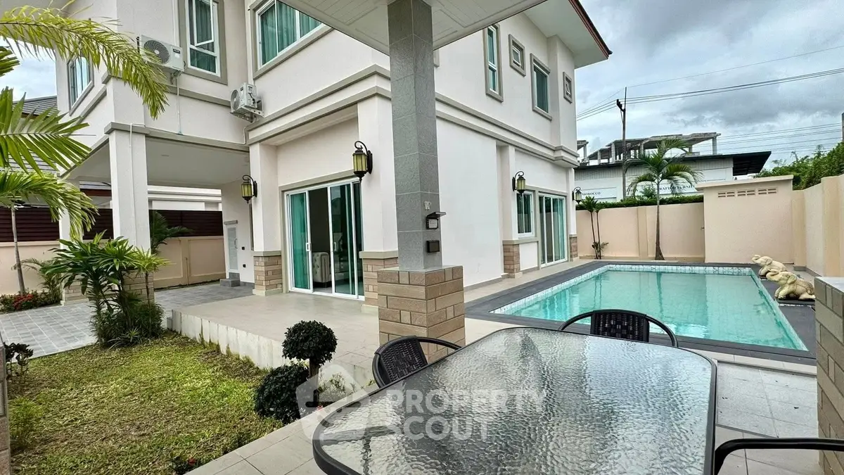 Luxurious modern home with private pool and spacious outdoor patio, perfect for entertaining.