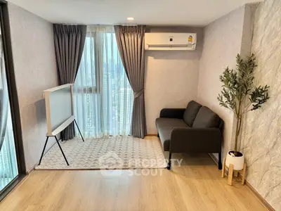 Modern living room with sleek sofa, air conditioning, and stylish decor