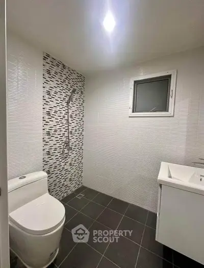 Modern bathroom with sleek design and stylish tile accents