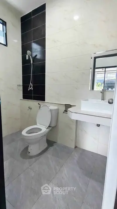 Modern bathroom with sleek tiles and contemporary fixtures