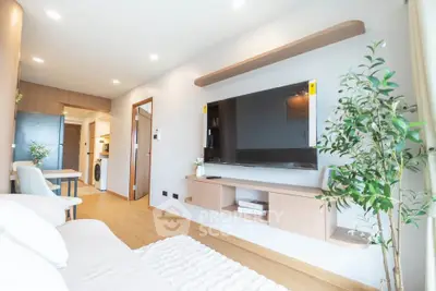 Modern living room with sleek TV setup and cozy decor