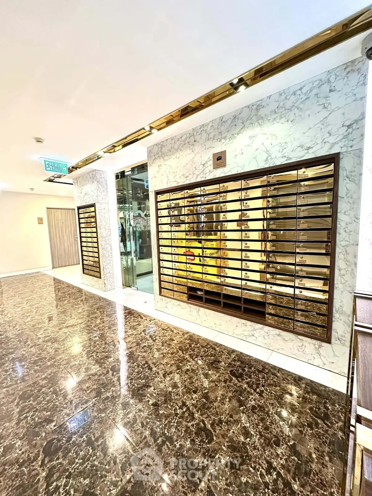 Luxurious building entrance with marble floors and modern mailboxes