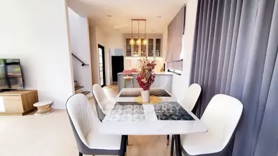 Modern dining area with elegant decor and open kitchen layout