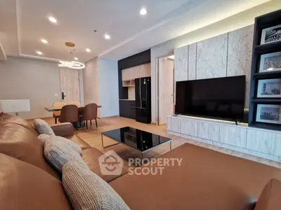 Luxurious modern living room with sleek furniture and open kitchen layout