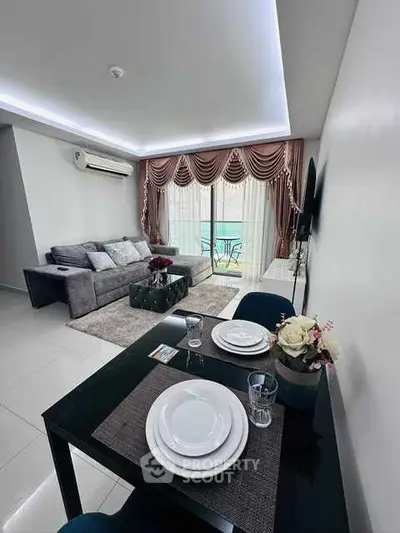 Modern living room with elegant decor and balcony view