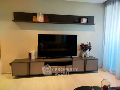 Modern living room with sleek TV stand and wall shelf decor