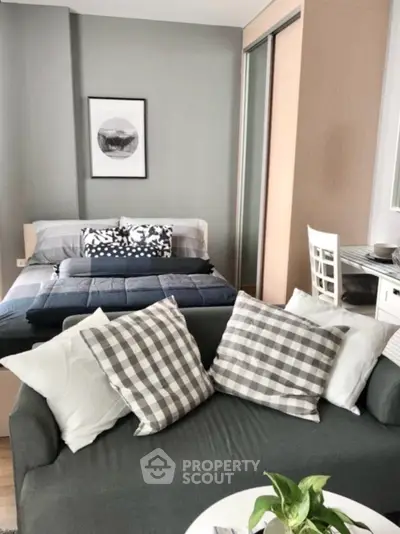 Stylish modern studio apartment with cozy living area and elegant decor