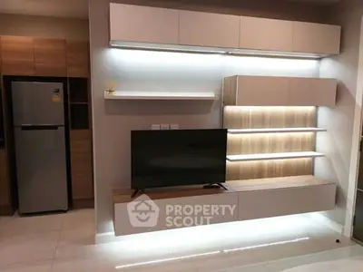 Modern living room with sleek TV unit and ambient lighting