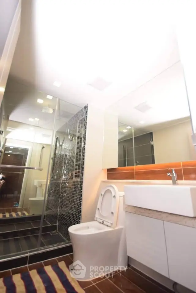 Modern bathroom with sleek design and glass shower enclosure