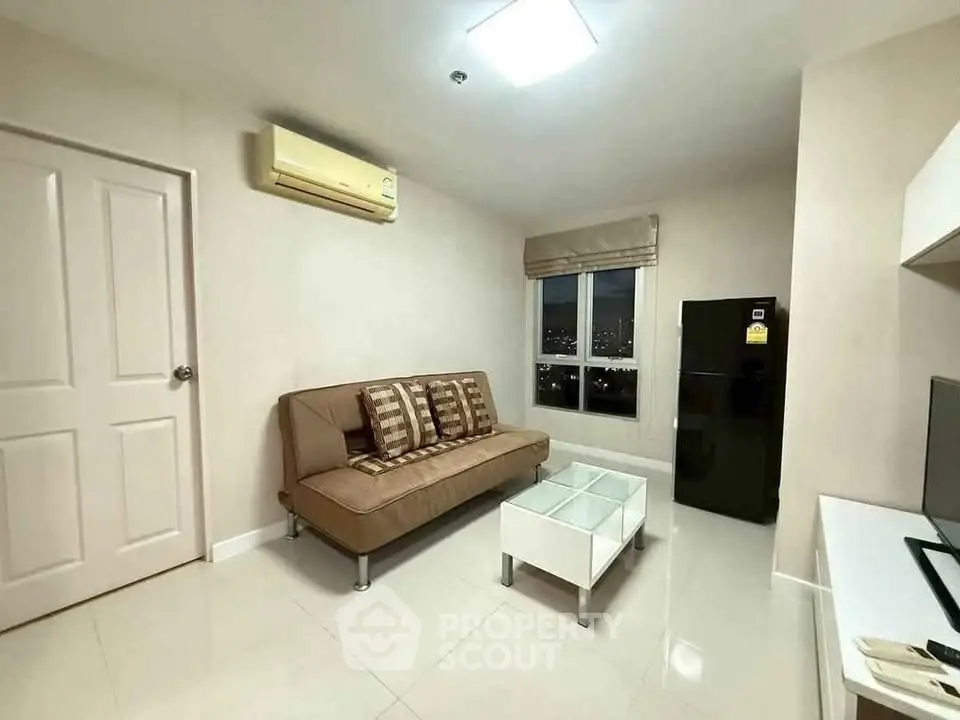 Modern living room with sleek furniture and city view window