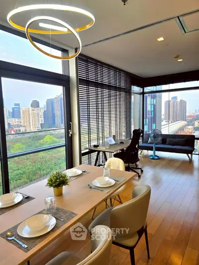 Stunning modern living room with city view, elegant dining area, and stylish workspace in high-rise apartment.
