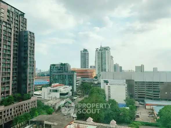 Stunning urban skyline view with modern high-rise buildings and lush greenery.