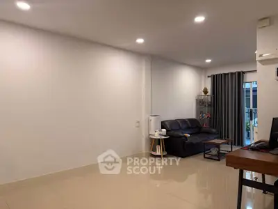 Spacious living room with modern decor and natural light