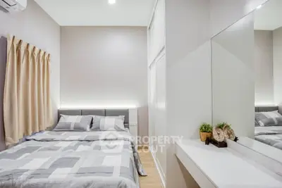 Modern bedroom with stylish decor and ample natural light