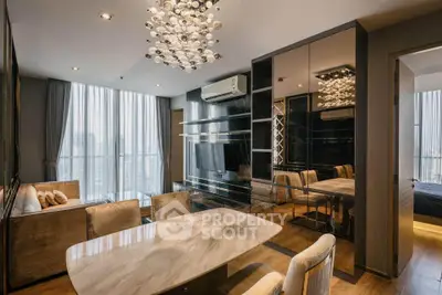Luxurious modern living room with elegant chandelier and city view