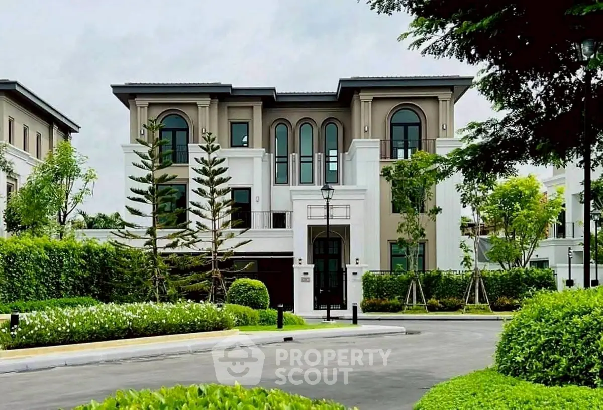 Luxurious modern villa with manicured garden and elegant facade in upscale neighborhood.