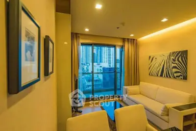 Modern living room with city view, featuring cozy sofa and stylish decor in high-rise apartment.