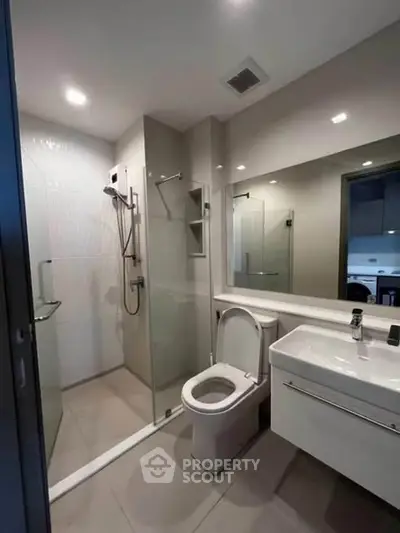 Modern bathroom with glass shower and sleek fixtures