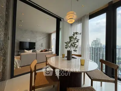 Luxurious modern living room with stunning city view and elegant dining area