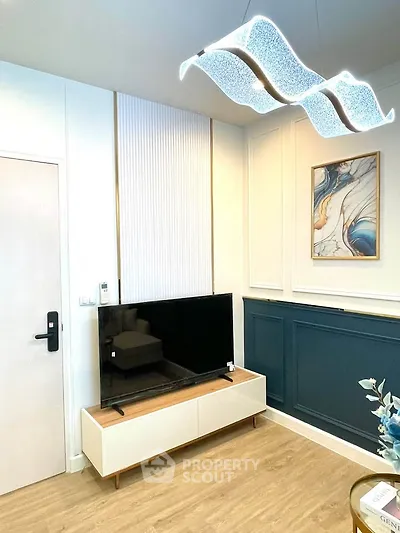 Modern living room with stylish decor and sleek TV setup