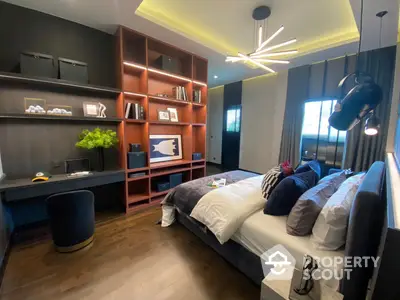 Modern bedroom with stylish furnishings, featuring a cozy bed, sleek shelving units, and a sophisticated lighting fixture, perfect for urban living.