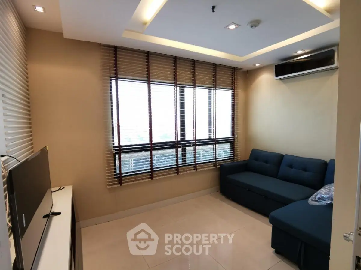 Modern living room with stylish blinds and cozy sofa