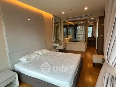Luxurious modern bedroom with city view, featuring elegant design and ample natural light.