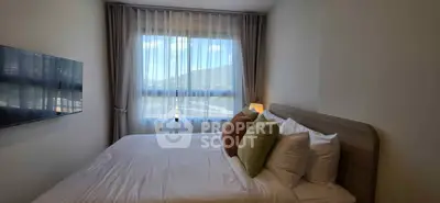 Cozy bedroom with mountain view, featuring a comfortable bed and modern decor.