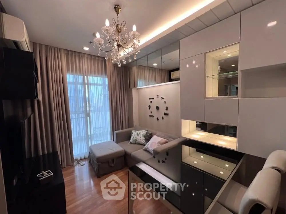 Luxurious living room with elegant chandelier and modern decor