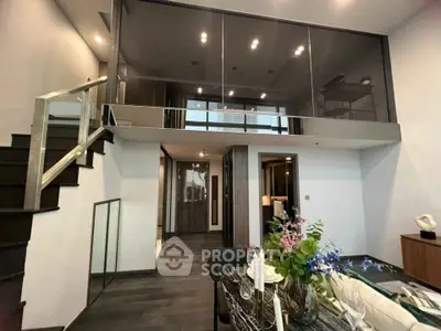 Modern duplex apartment with stylish interior and mezzanine level, featuring elegant decor and spacious layout.