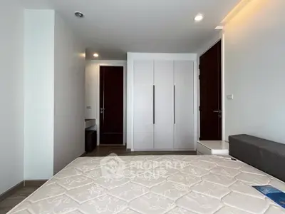 Modern bedroom with sleek wardrobe and minimalist design