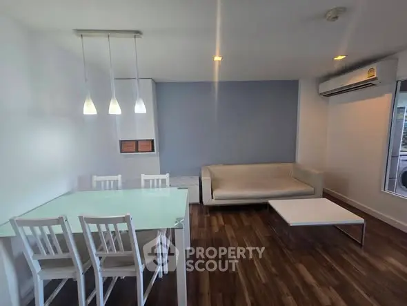 Modern living room with sleek furniture and elegant lighting