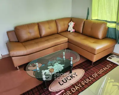 Stylish living room with brown leather sectional sofa and glass coffee table, perfect for modern comfort.